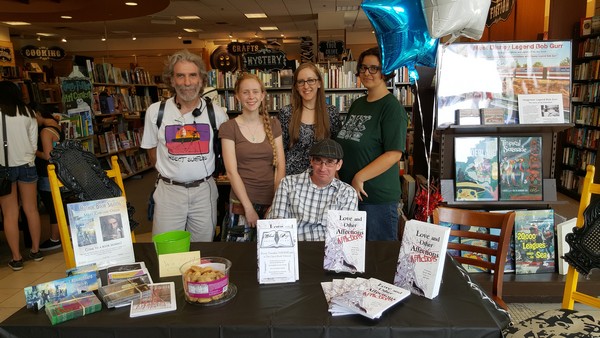 members of the Blank Page group around teh table